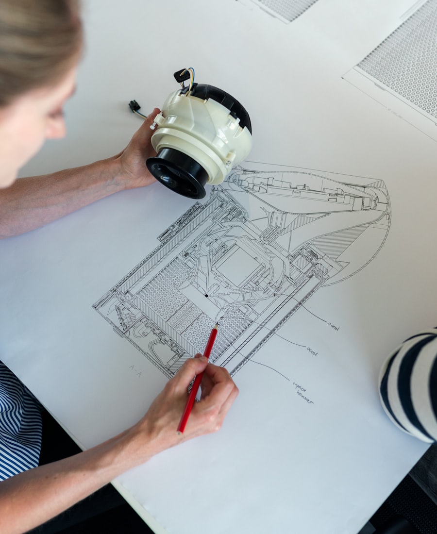 Engineer working on technical drawings