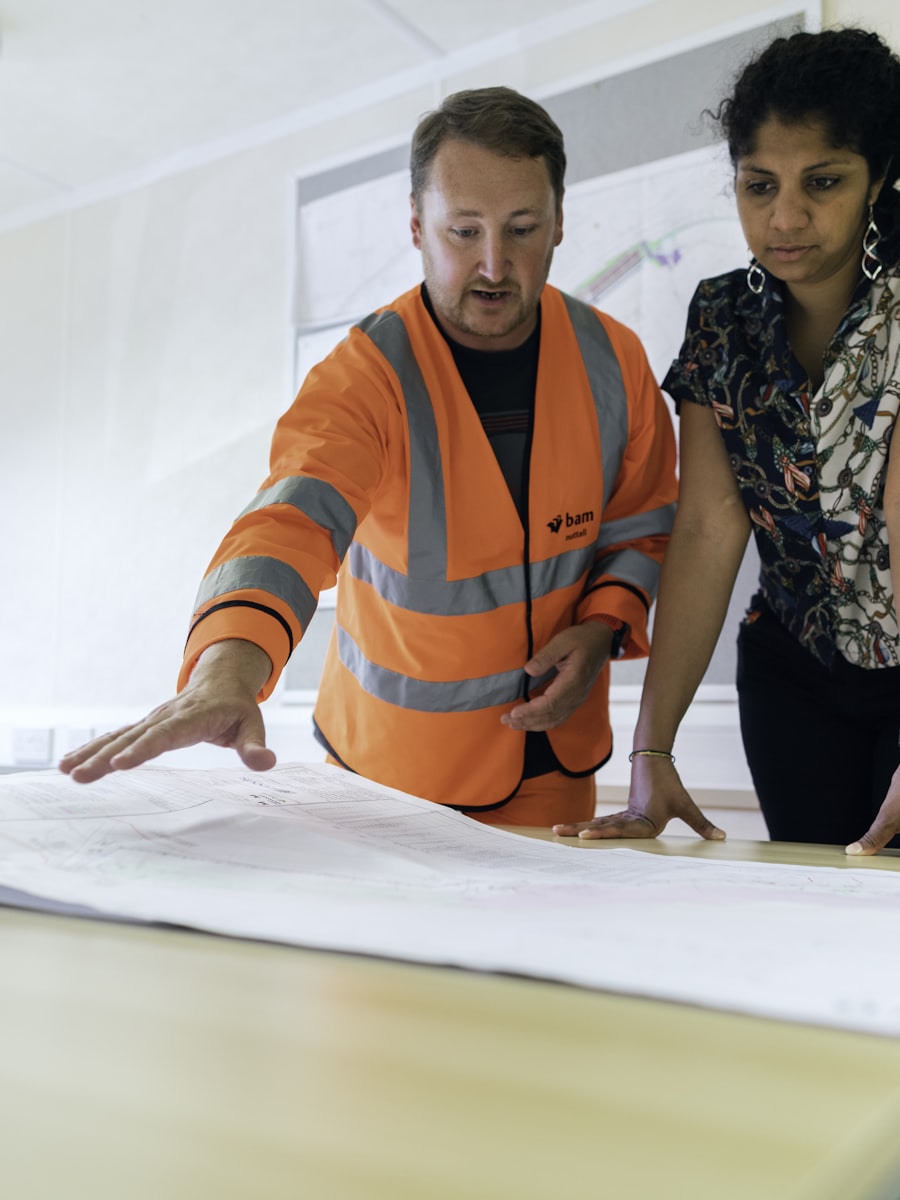 Engineers reviewing technical drawings on site